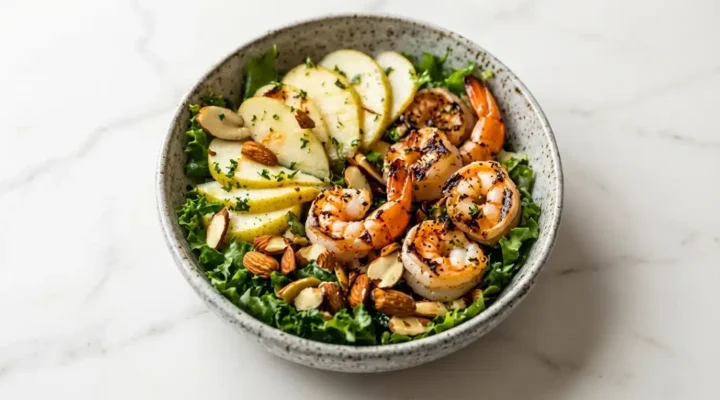 Delicious Apple Almond Shrimp Salad, naturally plated on white marble, ready to serve. Freshly cooked, realistic food photography.