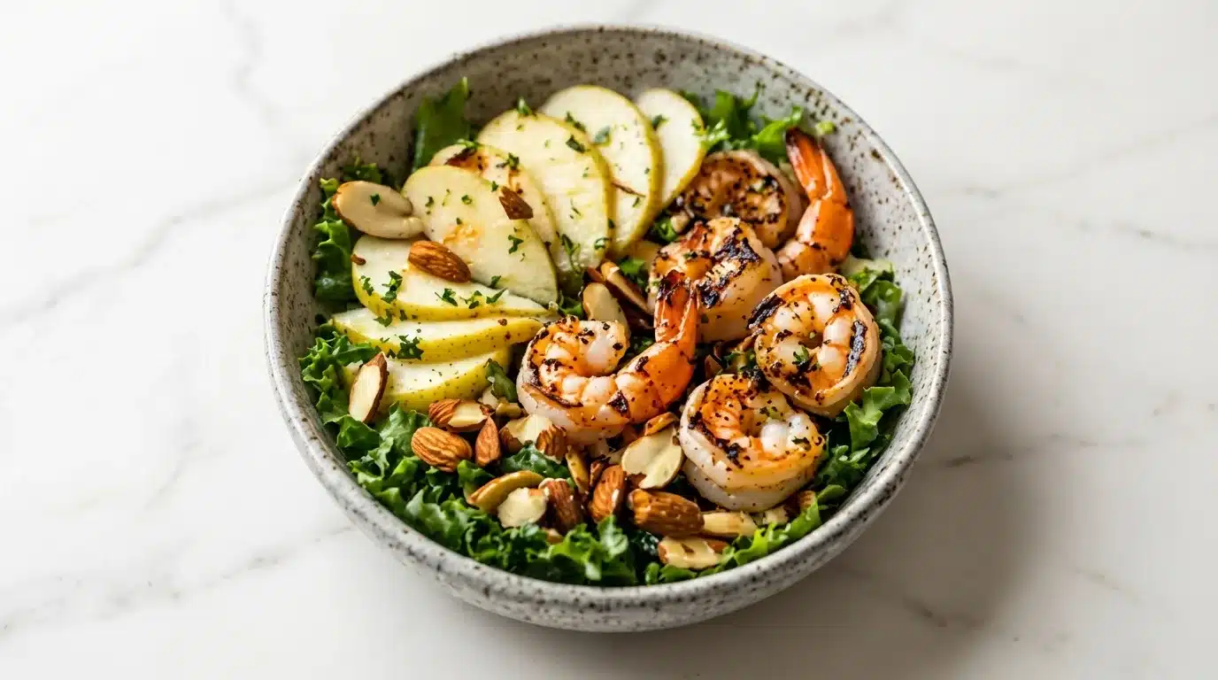 Apple Almond Shrimp Salad Delicious Apple Almond Shrimp Salad, naturally plated on white marble, ready to serve. Freshly cooked, realistic food photography.