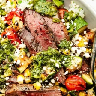 Delicious grilled chimichurri steak served in a vibrant bowl with fresh ingredients