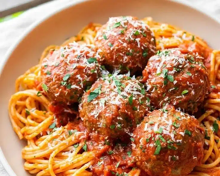 Delicious oven-baked Italian meatballs served with marinara sauce.