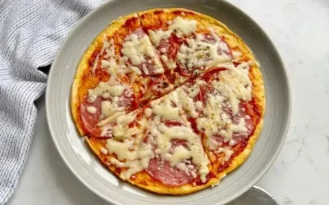 A delicious plate of Pizza Eggs featuring toppings like pepperoni and cheese.