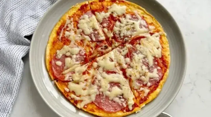 A delicious plate of Pizza Eggs featuring toppings like pepperoni and cheese.