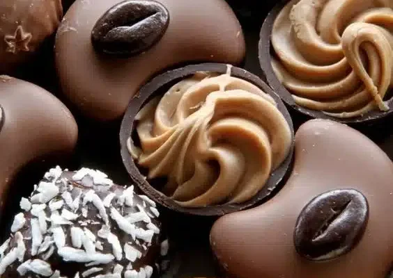 Delicious truffle bites elegantly presented on a white platter.