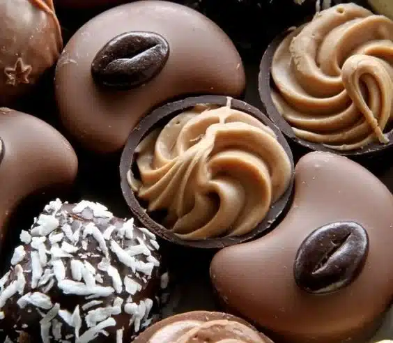 Delicious truffle bites elegantly presented on a white platter.