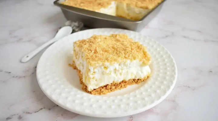 Photorealistic Pineapple Dream Dessert, finished and ready to serve, naturally plated on white marble, with natural side daylight.