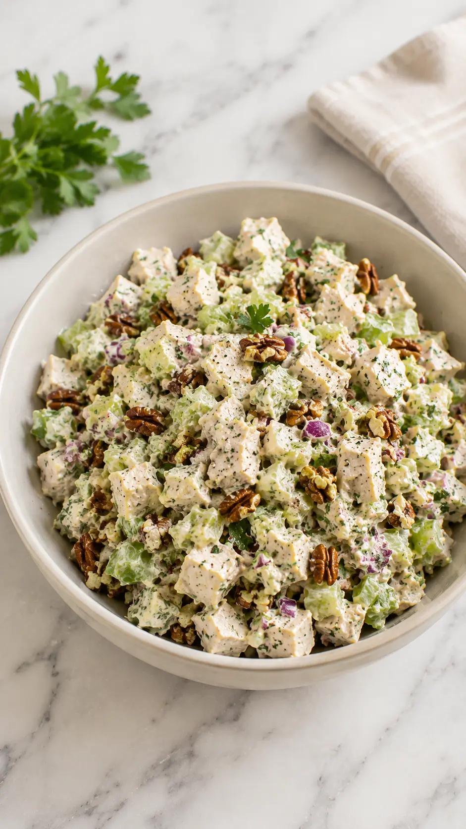 Healthy Chopped Southwest Chicken Salad Healthy Chopped Southwest Chicken Salad in a rustic bowl with creamy dressing, chicken, celery, pecans, and herbs on a white marble surface in a vertical 9:16 composition.